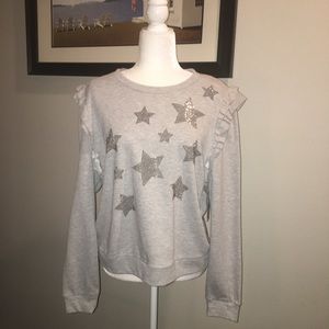 INC ruffled sweatshirt with rhinestone stars